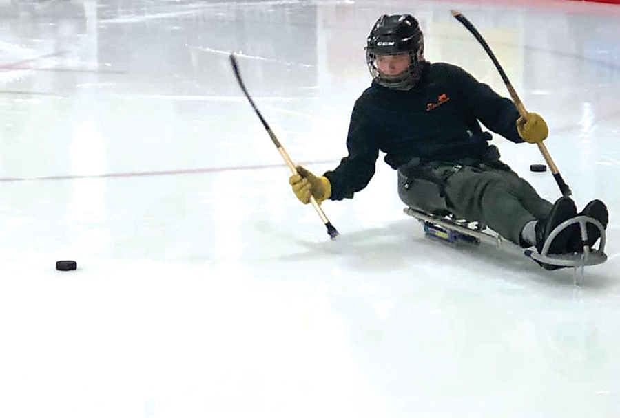 Levi playing Sledge Hockey